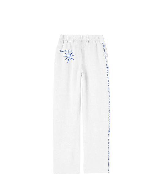 Pantalon rayé Blanc – vue de dos Détail soigné et coupe droite, parfait pour les journées ensoleillées et les fins d’après-midi dorées.