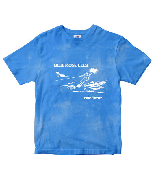 T-shirt bleu clair délavé Bleu mon Jules, dessin skieuse nautique et lettrage « Bleu mon Jules · Côte d'Azur », vue de face