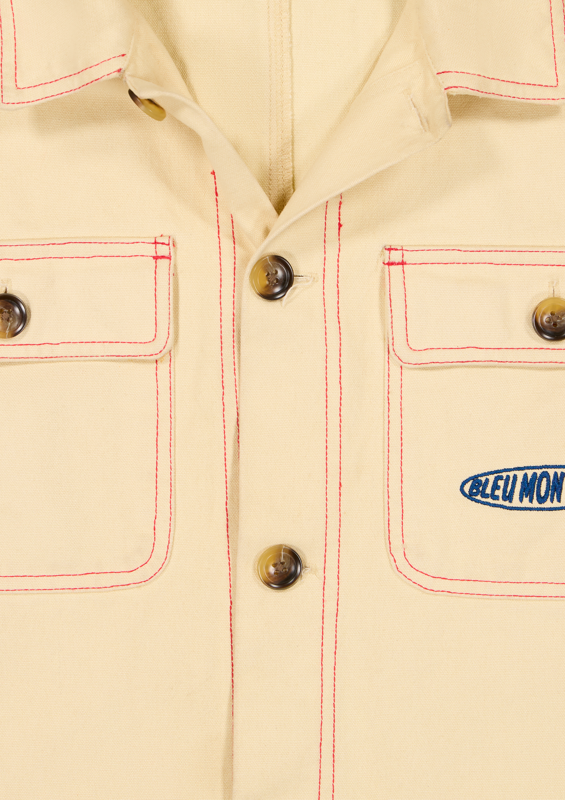 Veste beige Bleu Montagnes boutonnage avant coutures rouges contrastées poches plaquées détail